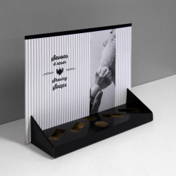 Printed Cardboard counter display with header and 6 cuts to insert products (4 rectangles and 2 circles) - front view